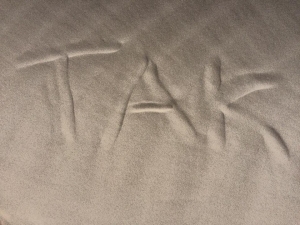 Tak skrevet i sandet